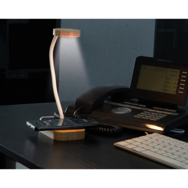 Лого трейд бизнес-подарки фото: Беспроводная зарядка Томск